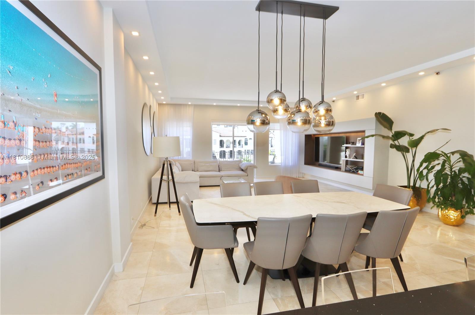 3900 Island Boulevard, Unit PH2 Aventura, FL 33160 - Photo 13 of 39 a view of a dining room with furniture and chandelier
