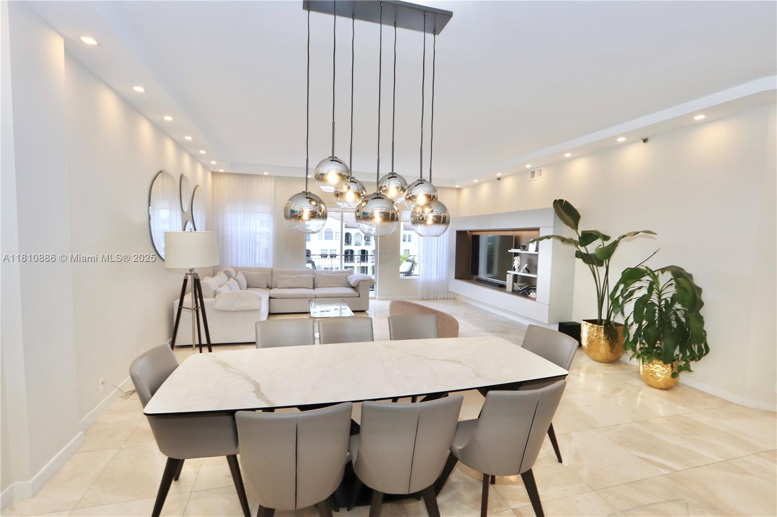 3900 Island Boulevard, Unit PH2 Aventura, FL 33160 - Photo 14 of 39 a dining room with furniture and wooden floor