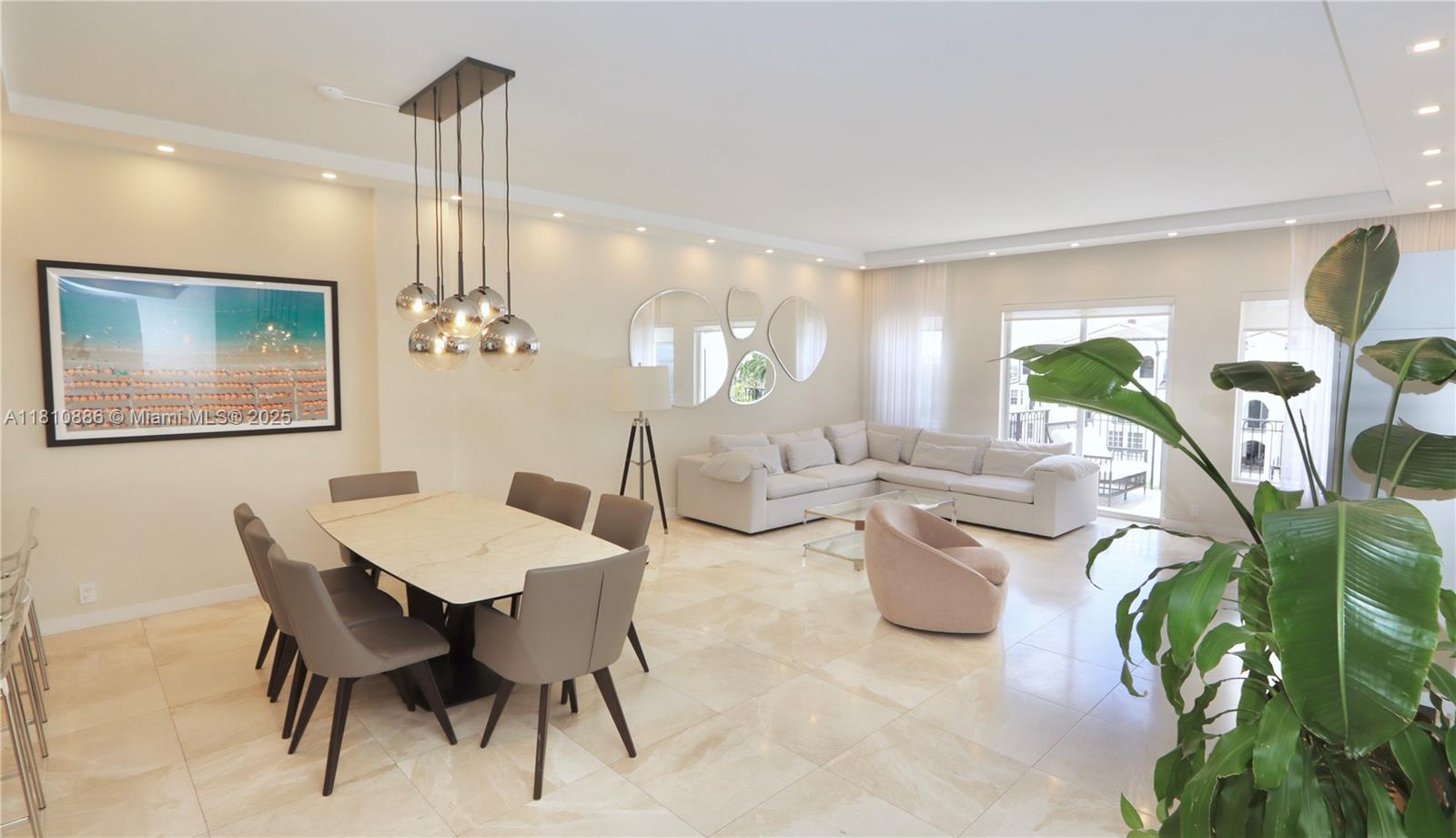 3900 Island Boulevard, Unit PH2 Aventura, FL 33160 - Photo 16 of 39 a view of a dining room and livingroom with furniture wooden floor a chandelier