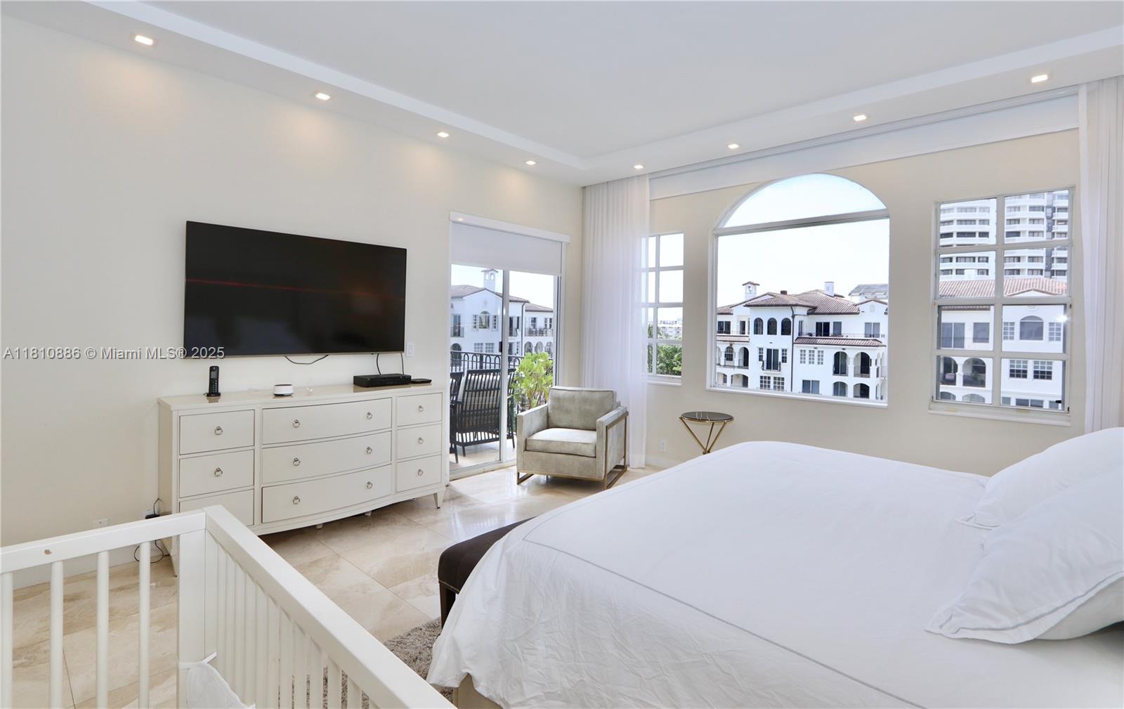 3900 Island Boulevard, Unit PH2 Aventura, FL 33160 - Photo 18 of 39 a bedroom with a bed and a flat screen tv