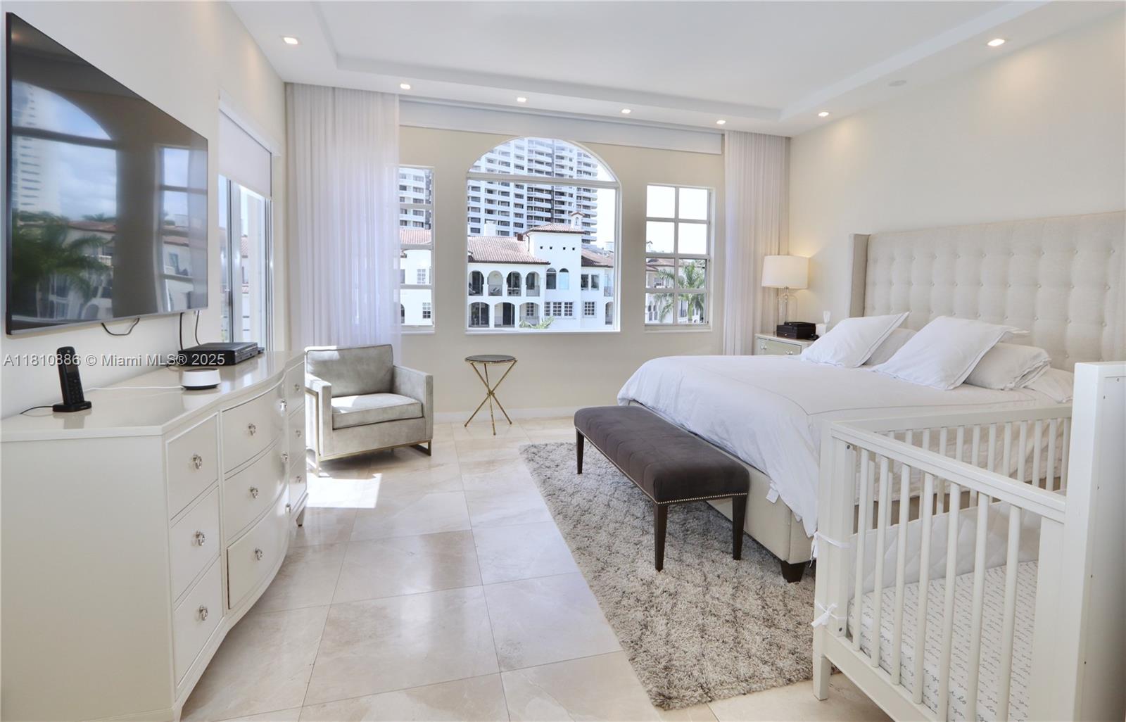 3900 Island Boulevard, Unit PH2 Aventura, FL 33160 - Photo 21 of 39 a living room with furniture and a large window