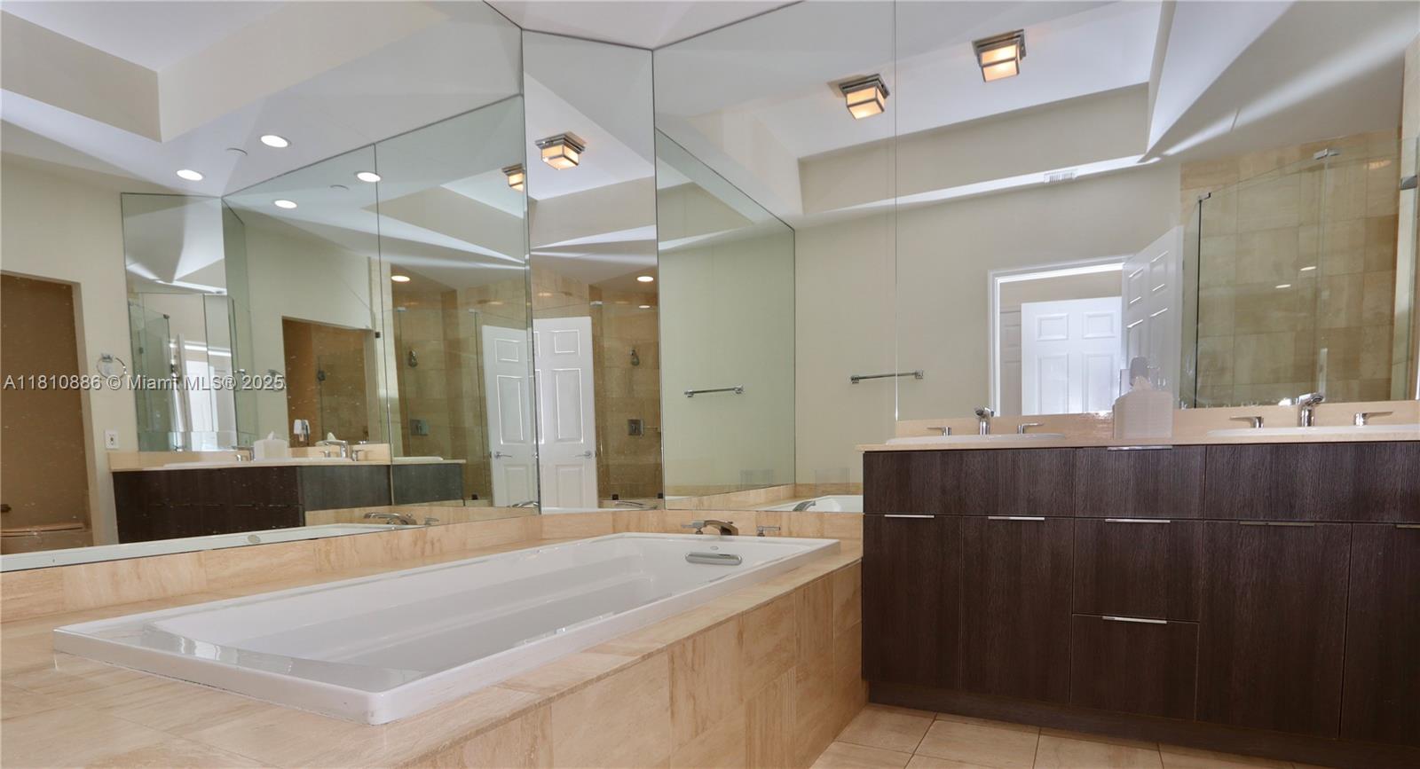 3900 Island Boulevard, Unit PH2 Aventura, FL 33160 - Photo 22 of 39 a spacious bathroom with a bathtub sink mirror and shower