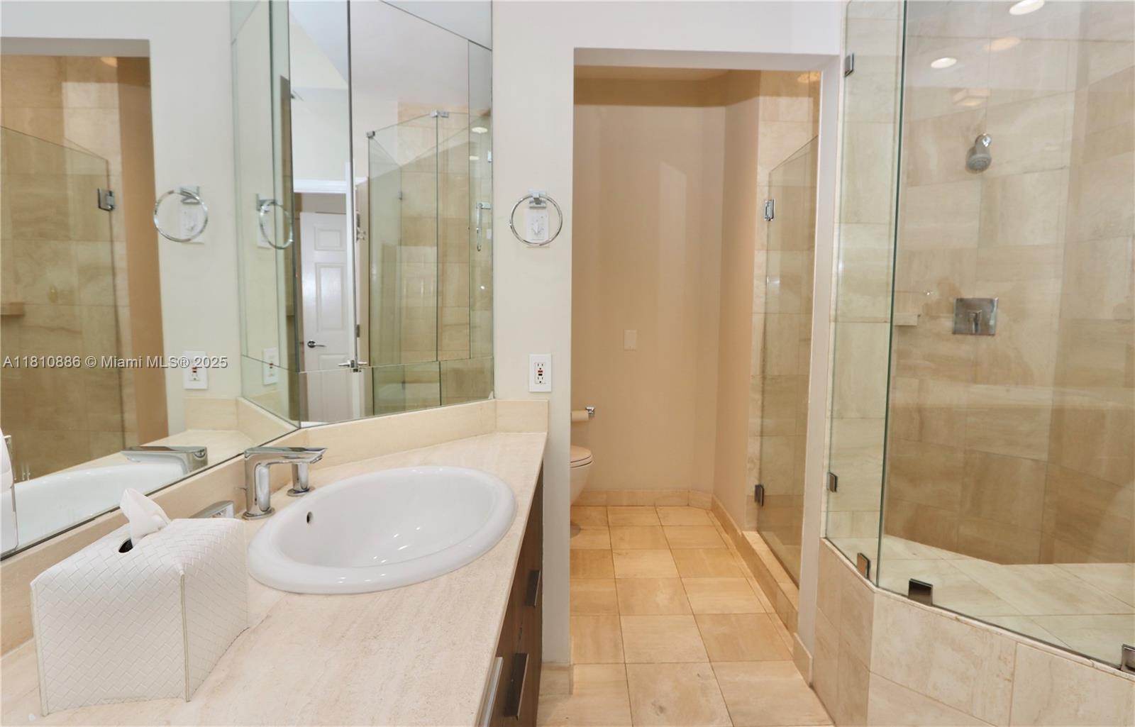 3900 Island Boulevard, Unit PH2 Aventura, FL 33160 - Photo 23 of 39 a bathroom with a bathtub and a sink