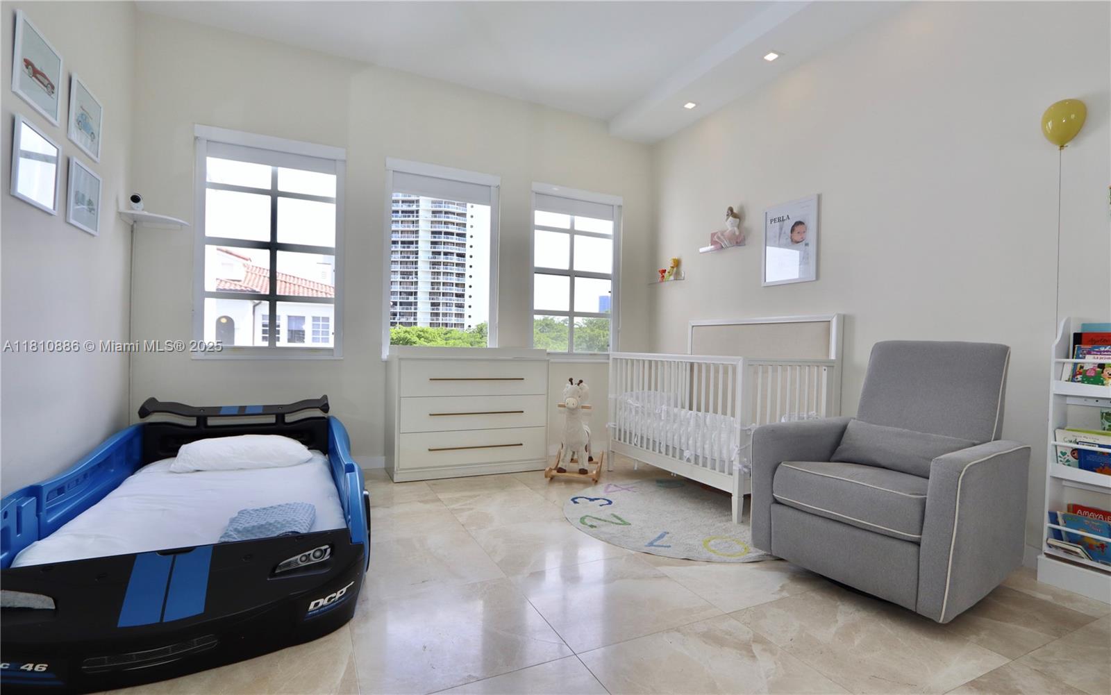 3900 Island Boulevard, Unit PH2 Aventura, FL 33160 - Photo 25 of 39 a bedroom with furniture and window