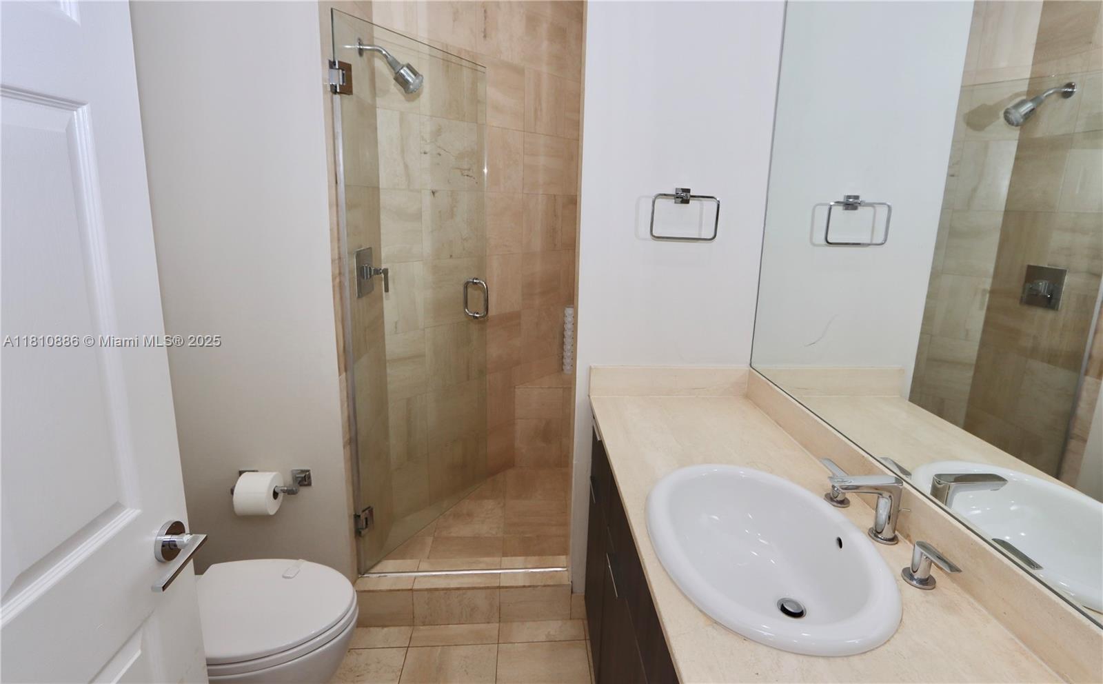 3900 Island Boulevard, Unit PH2 Aventura, FL 33160 - Photo 26 of 39 a bathroom with a sink toilet and shower