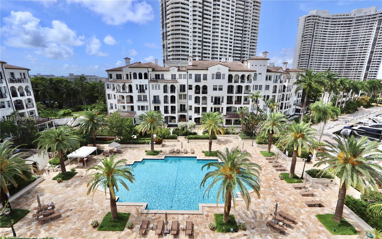 3900 Island Boulevard, Unit PH2 Aventura, FL 33160 - Photo 28 of 39 a view of a patio with plants and palm trees