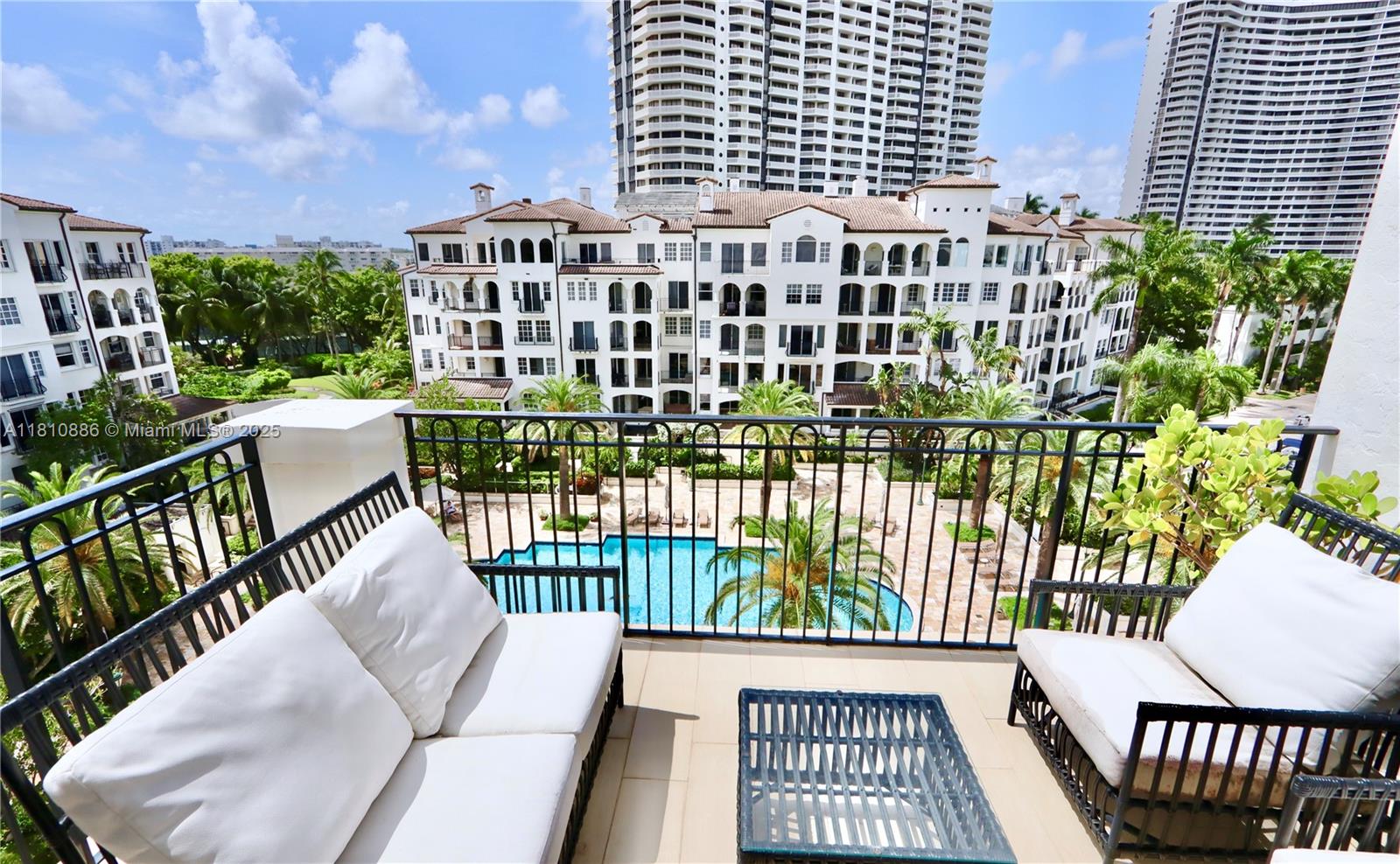 3900 Island Boulevard, Unit PH2 Aventura, FL 33160 - Photo 31 of 39 a view of a balcony with wooden floor
