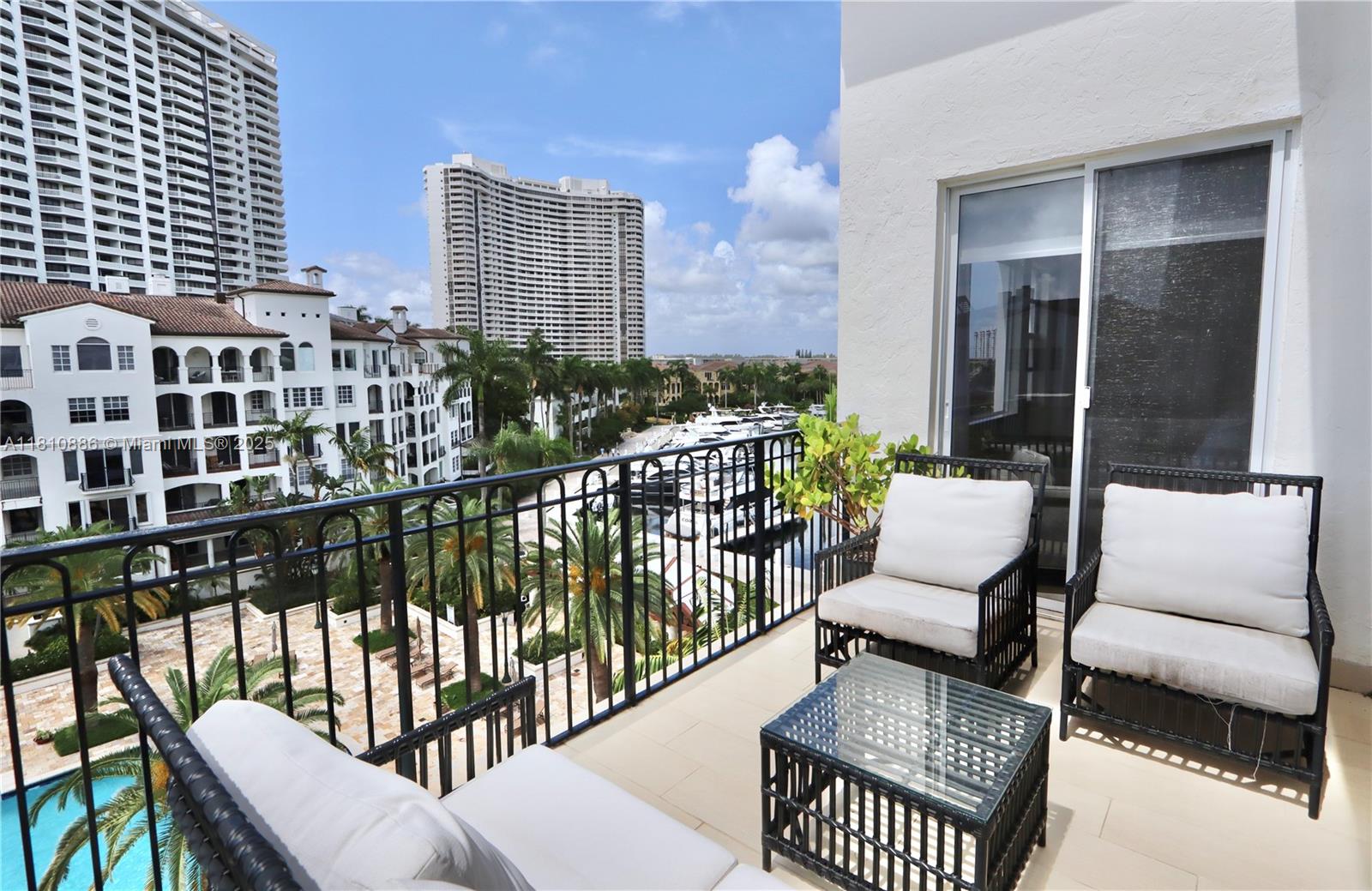 3900 Island Boulevard, Unit PH2 Aventura, FL 33160 - Photo 32 of 39 a view of a balcony with couch