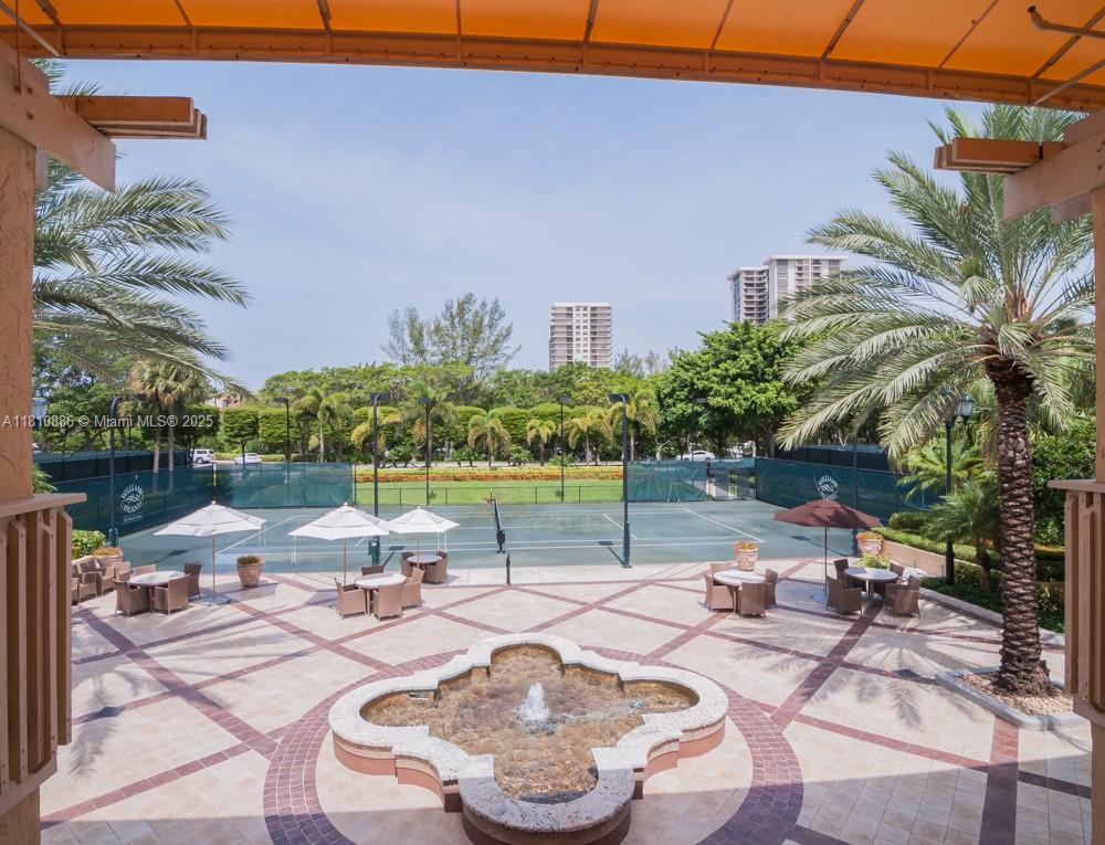 3900 Island Boulevard, Unit PH2 Aventura, FL 33160 - Photo 5 of 39 a view of a patio with furniture and a garden