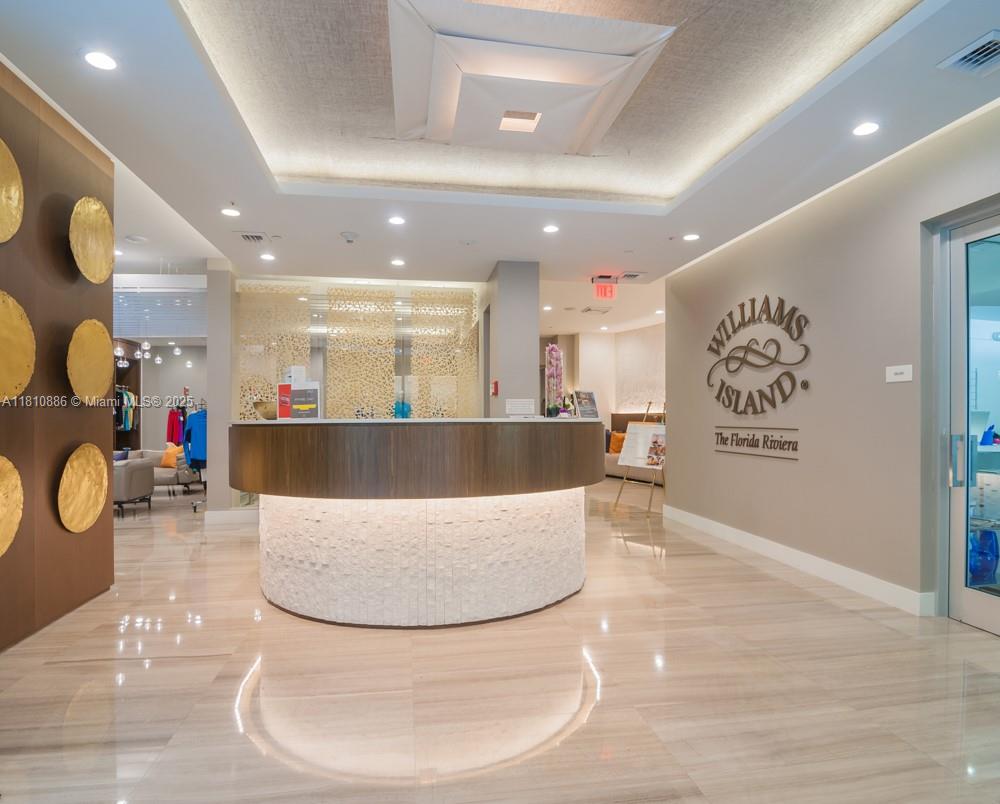 3900 Island Boulevard, Unit PH2 Aventura, FL 33160 - Photo 6 of 39 a view of a living room and kitchen