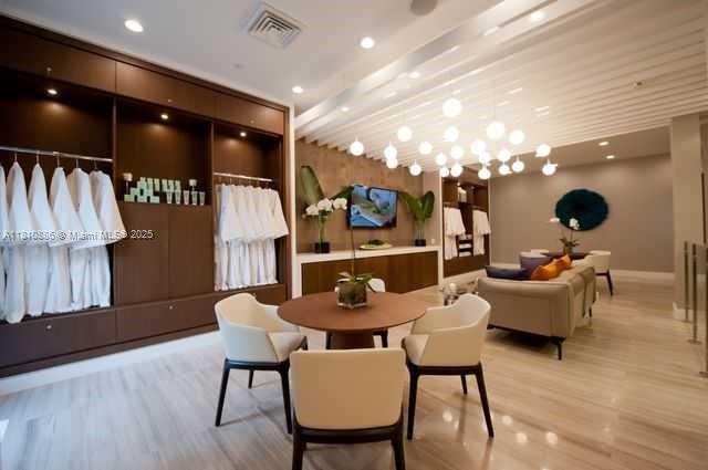 3900 Island Boulevard, Unit PH2 Aventura, FL 33160 - Photo 10 of 39 a dining room with furniture and wooden floor