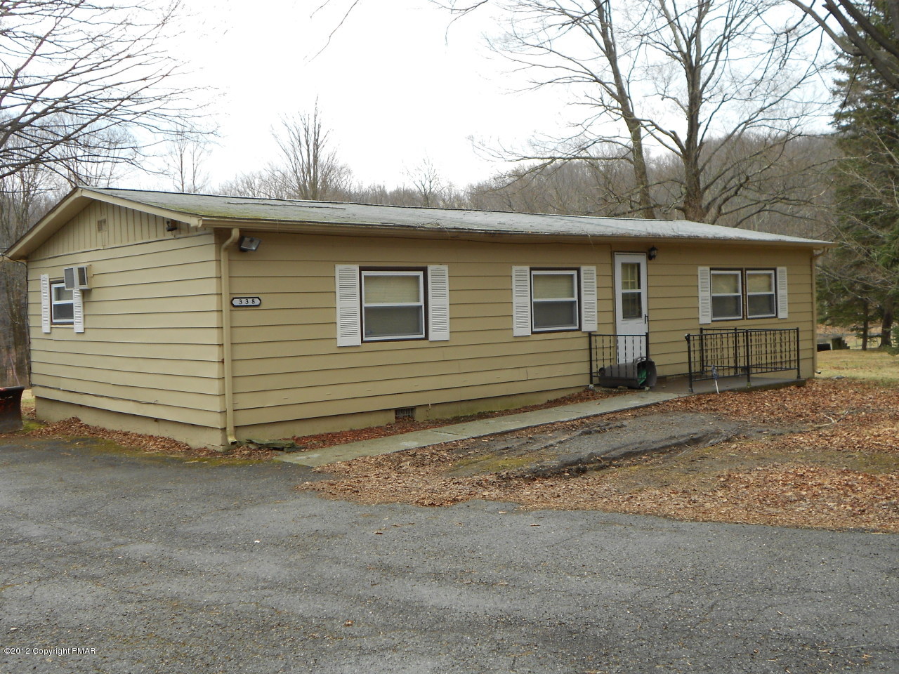 a view of a house with a yard and garage