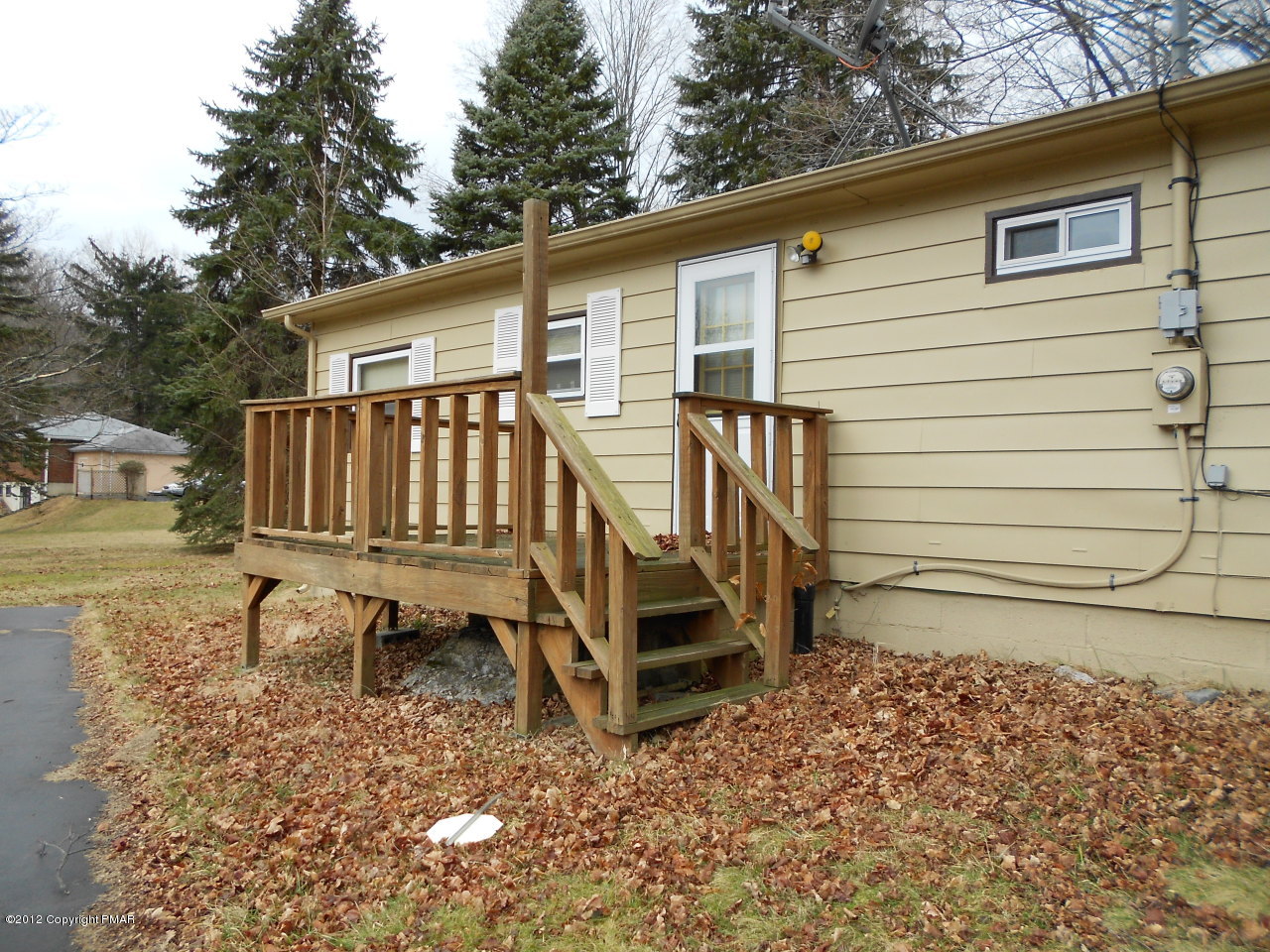 338 Summit Road Swiftwater, PA 18370 - Photo 3 of 15 a view of a small house with a yard and sitting area
