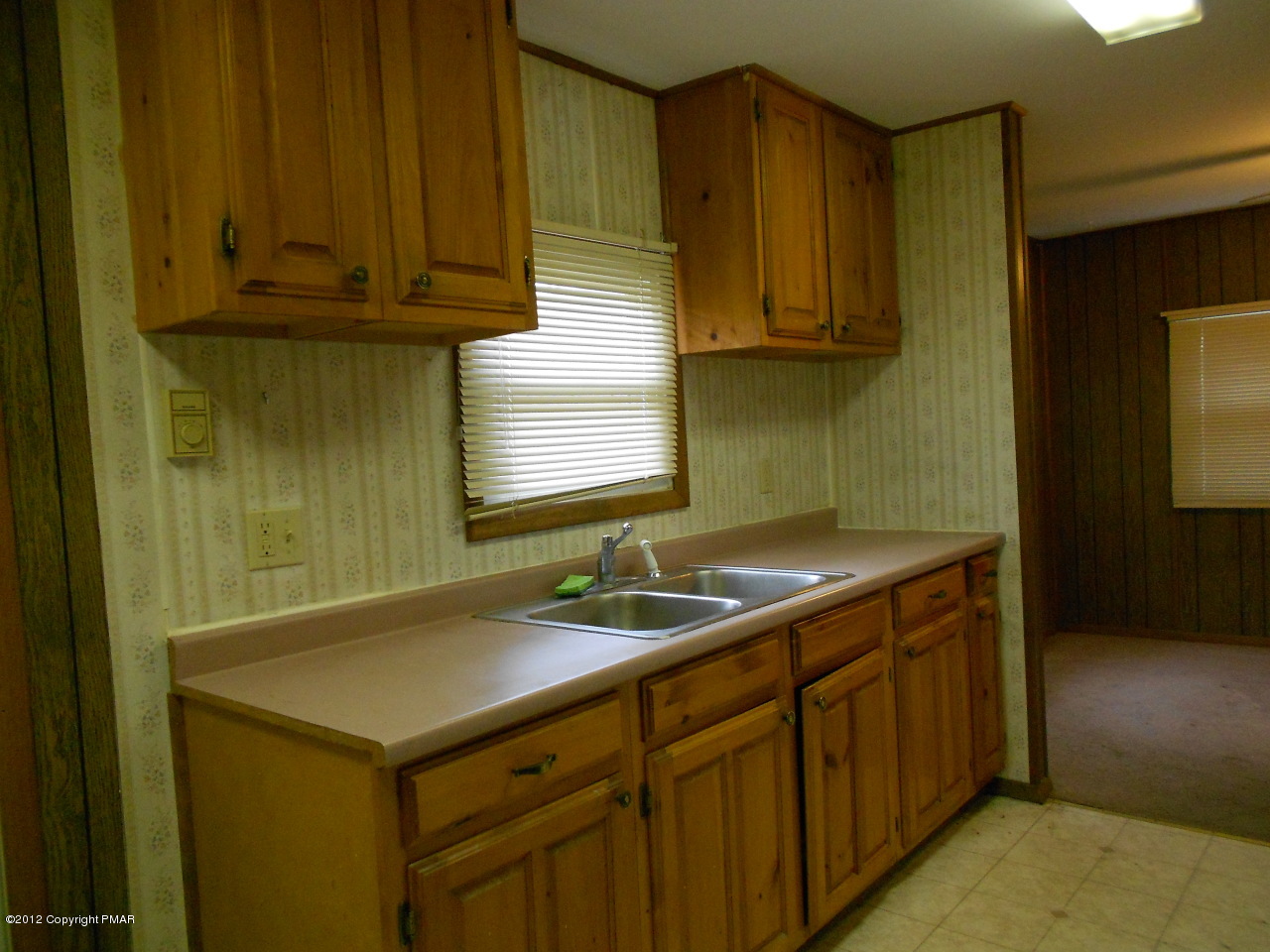 338 Summit Road Swiftwater, PA 18370 - Photo 4 of 15 a kitchen with a sink and cabinets