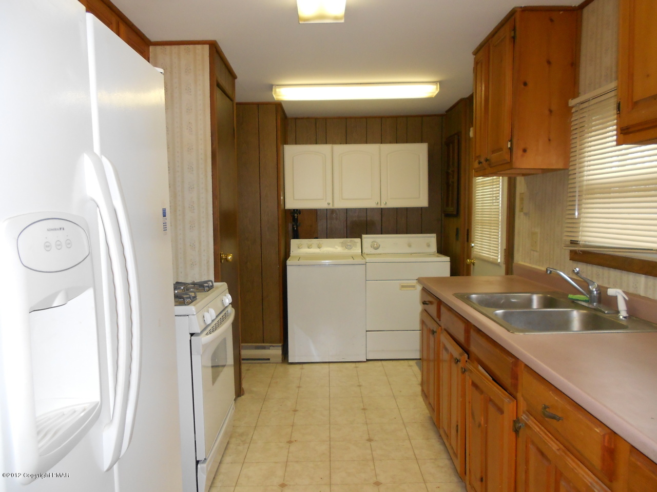 338 Summit Road Swiftwater, PA 18370 - Photo 5 of 15 a kitchen with a sink a stove a refrigerator and a window