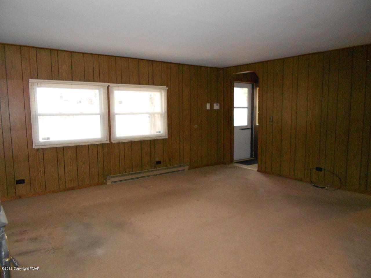 338 Summit Road Swiftwater, PA 18370 - Photo 6 of 15 an empty room with windows
