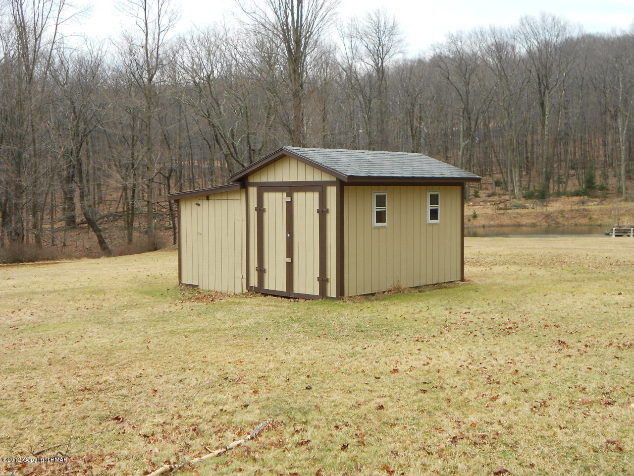 338 Summit Road Swiftwater, PA 18370 - Photo 8 of 15 a view of a wooden house with a yard