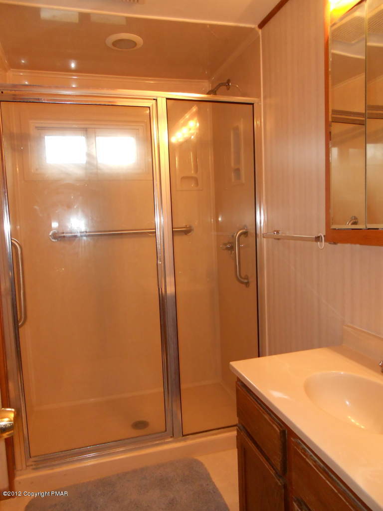 338 Summit Road Swiftwater, PA 18370 - Photo 10 of 15 a bathroom with a shower and a sink