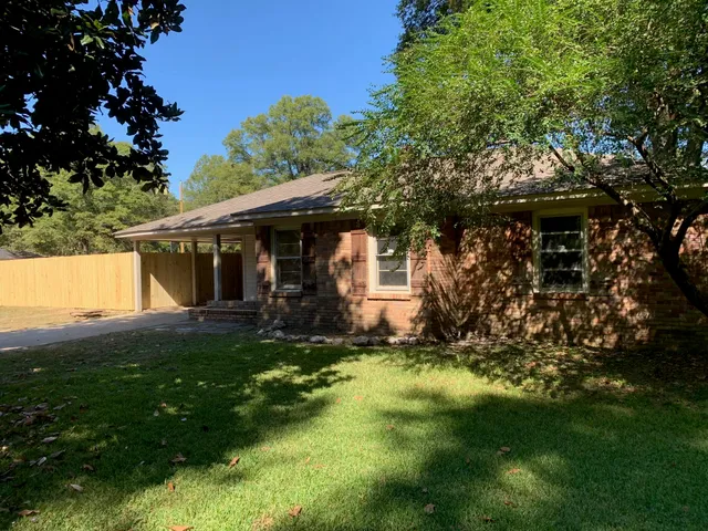 a view of a back yard of the house
