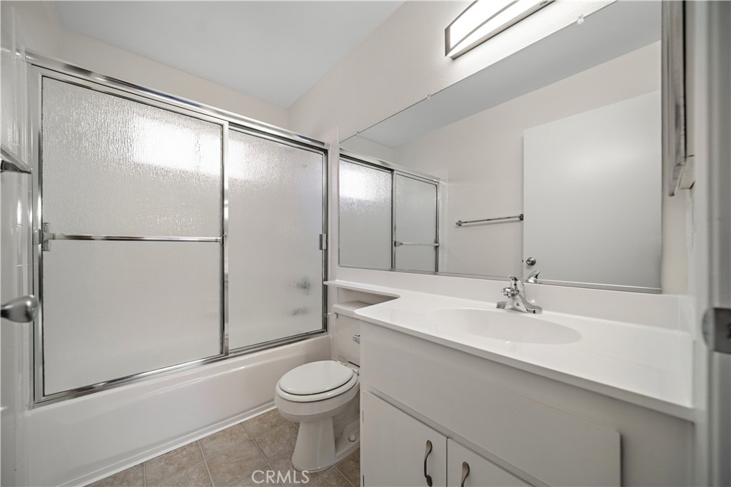 1349 Elm Avenue San Gabriel, CA 91775 - Photo 6 of 10 a bathroom with a sink a toilet and a large mirror