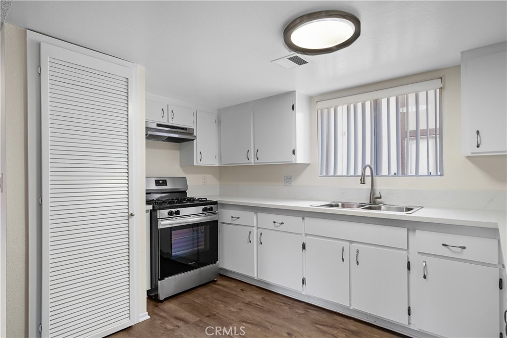 1349 Elm Avenue San Gabriel, CA 91775 - Photo 7 of 10 a kitchen with cabinets appliances a sink and a window