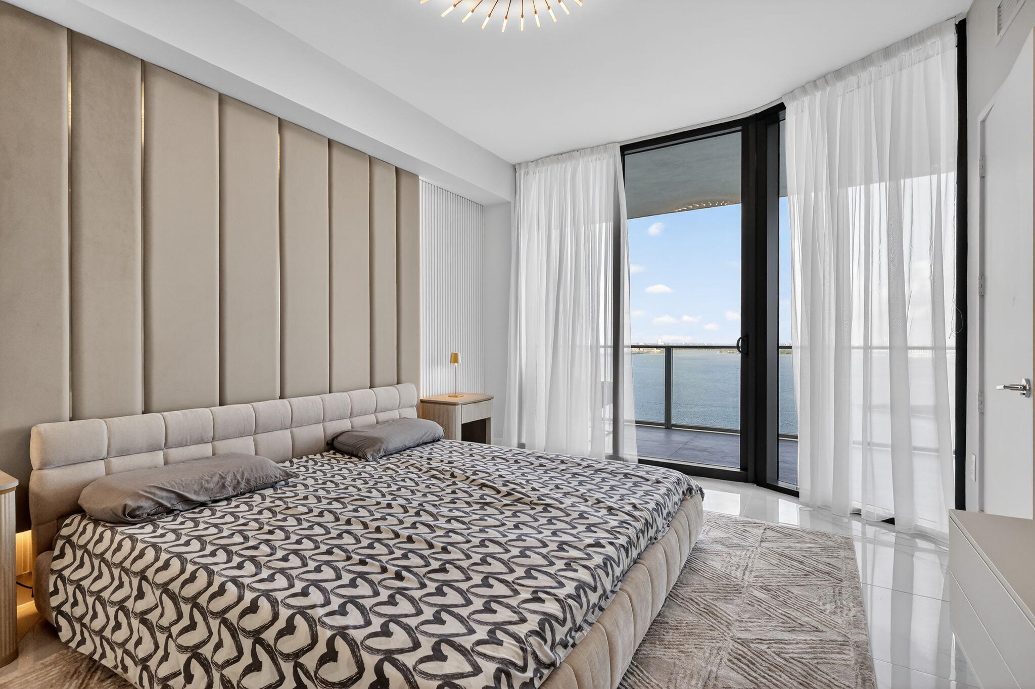 700 Northeast 23rd Street, Unit 3206 Miami, FL 33137 - Photo 12 of 37 a bedroom with a bed and a window