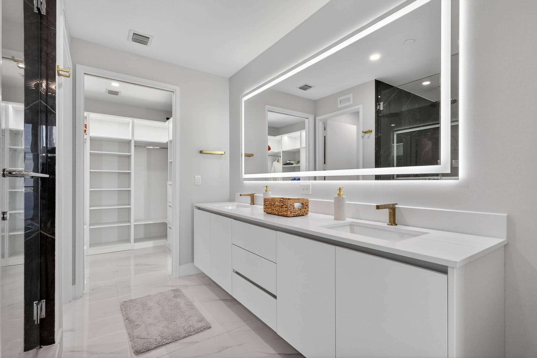 700 Northeast 23rd Street, Unit 3206 Miami, FL 33137 - Photo 15 of 37 a bathroom with a sink and a mirror