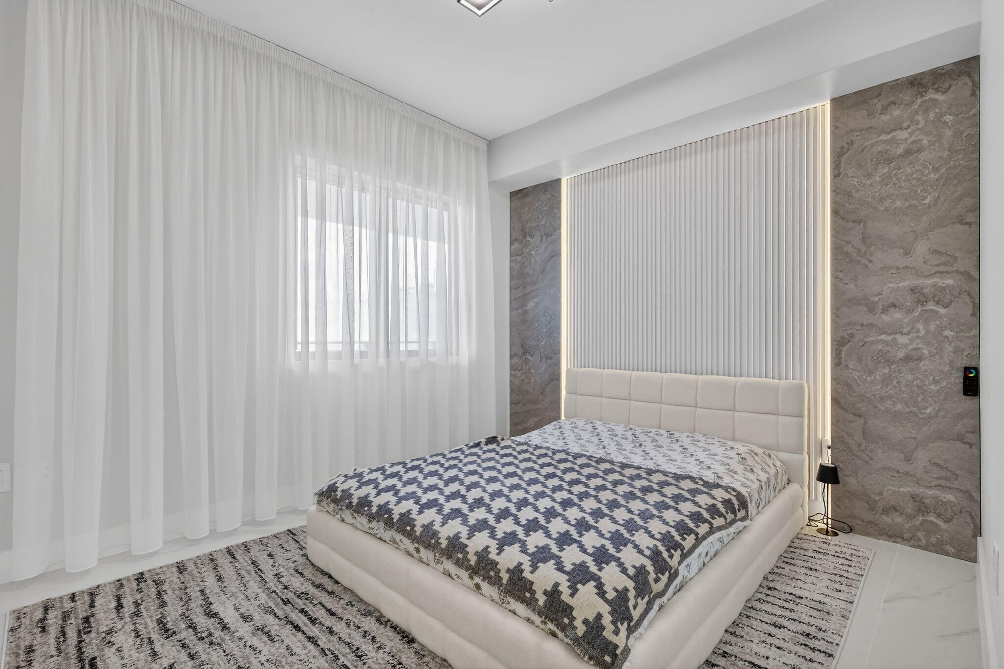 700 Northeast 23rd Street, Unit 3206 Miami, FL 33137 - Photo 18 of 37 a bedroom with a bed and a window