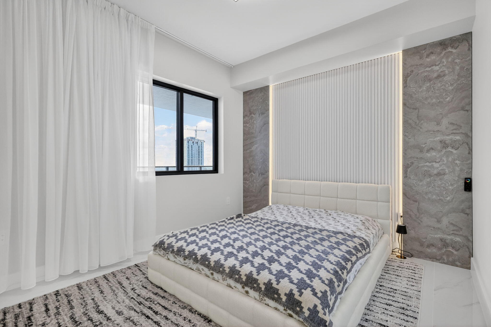 700 Northeast 23rd Street, Unit 3206 Miami, FL 33137 - Photo 19 of 37 a bedroom with a bed and a window