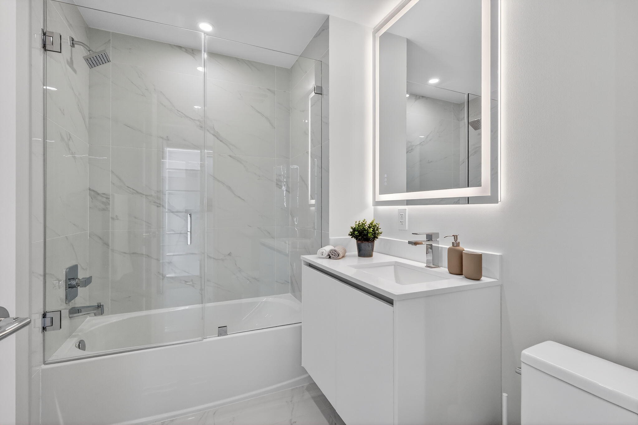 700 Northeast 23rd Street, Unit 3206 Miami, FL 33137 - Photo 22 of 37 a bathroom with a sink a toilet and shower