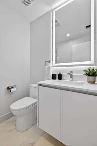 a bathroom with a shower and a toilet