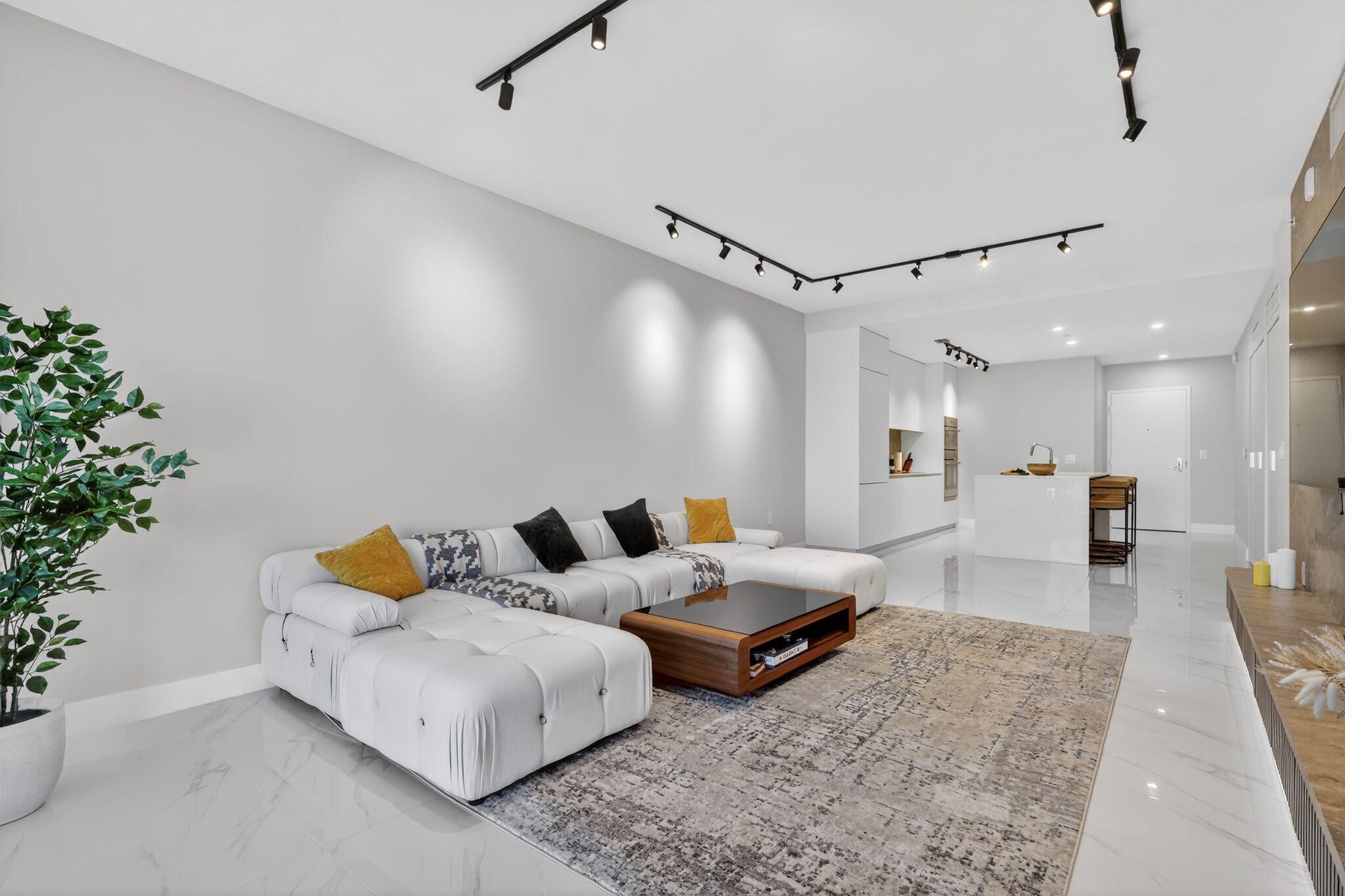 700 Northeast 23rd Street, Unit 3206 Miami, FL 33137 - Photo 8 of 37 a living room with furniture and a table