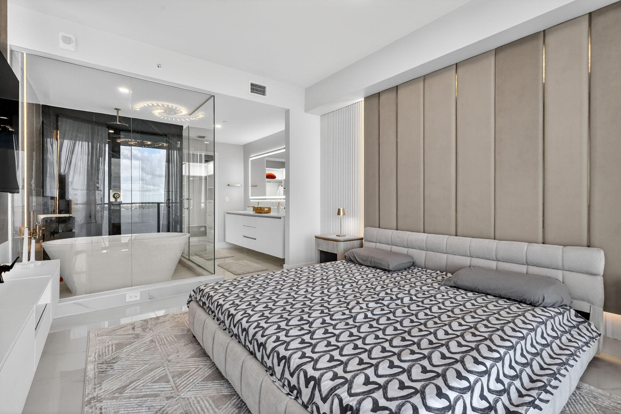 700 Northeast 23rd Street, Unit 3206 Miami, FL 33137 - Photo 10 of 37 a bedroom with a large bed and a couch