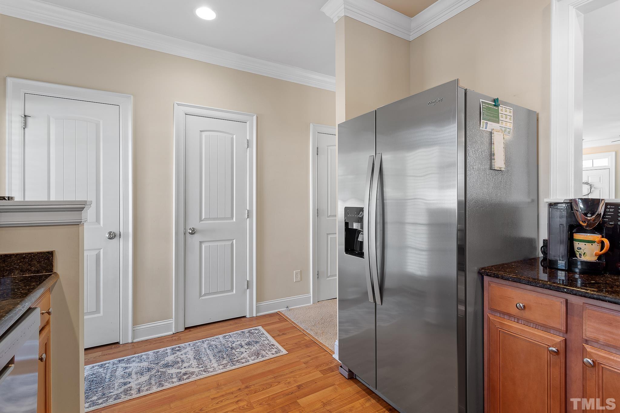 7708 Alexander Promenade Place Raleigh, NC 27617 - Photo 14 of 27 a bathroom with a granite countertop shower a sink and a mirror
