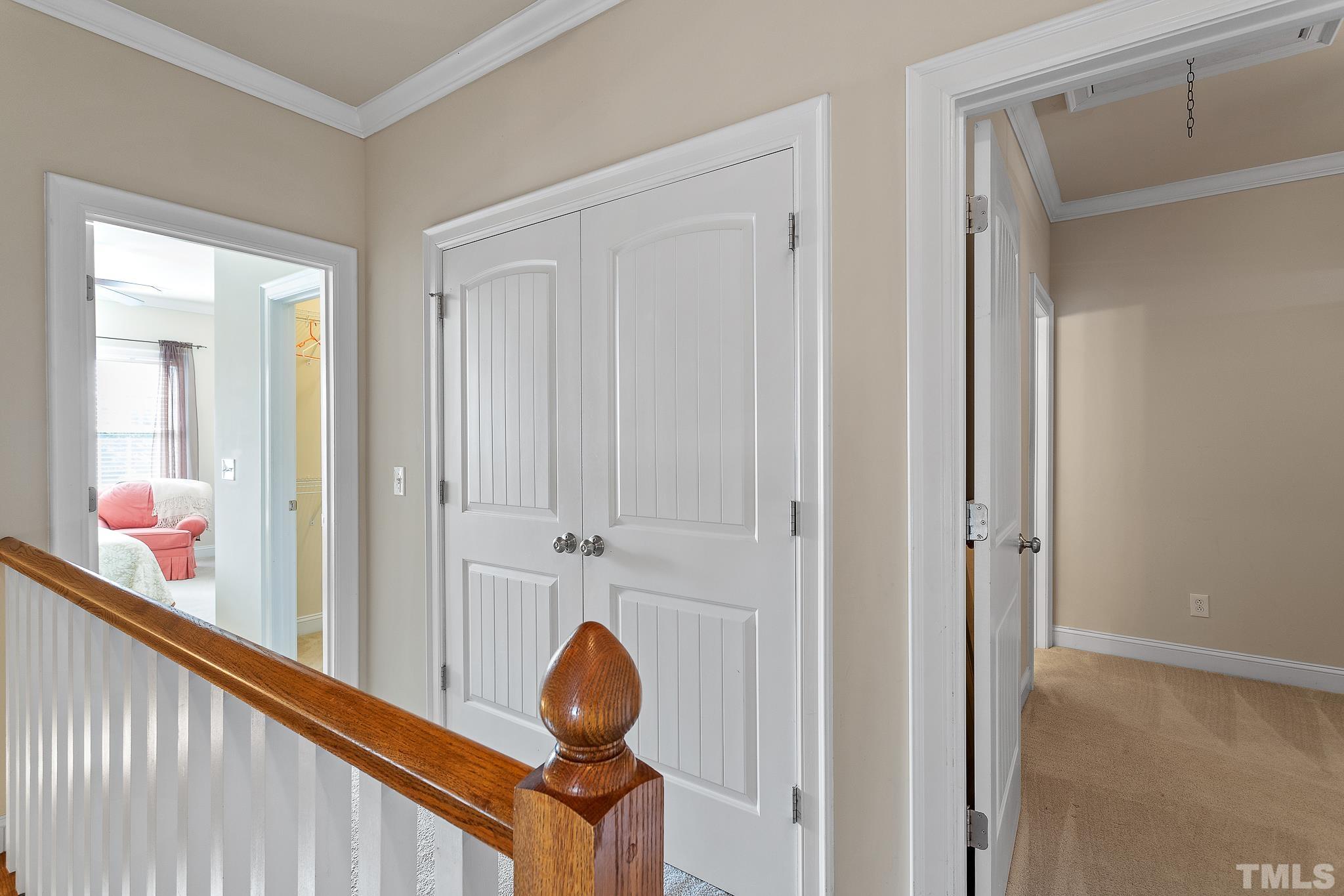 7708 Alexander Promenade Place Raleigh, NC 27617 - Photo 16 of 27 a view of a hallway and a closet