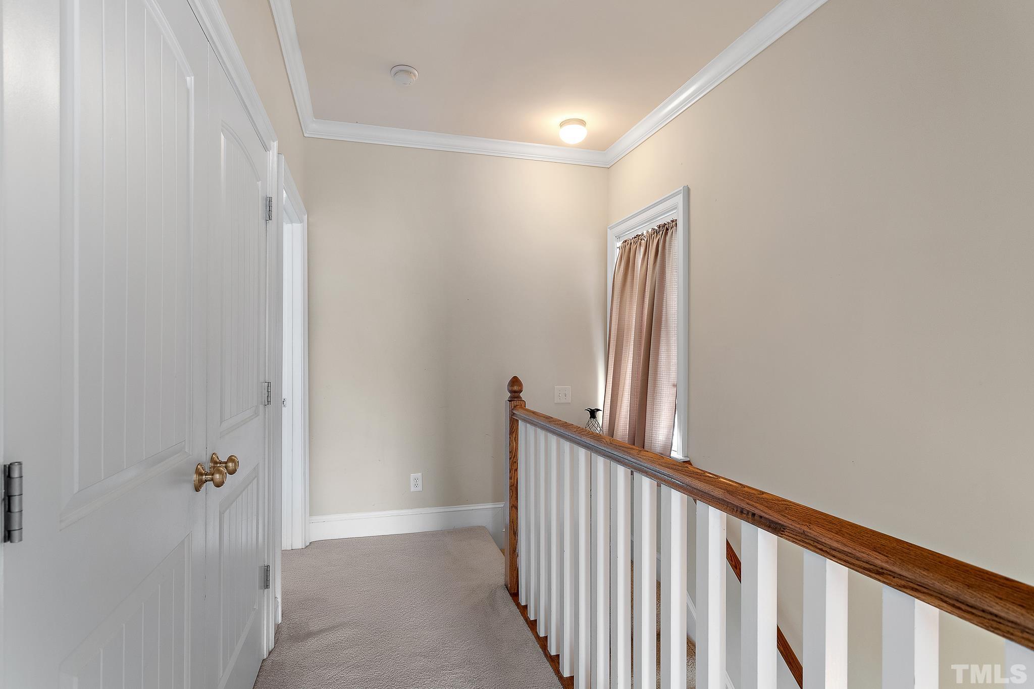 7708 Alexander Promenade Place Raleigh, NC 27617 - Photo 17 of 27 a view of hallway