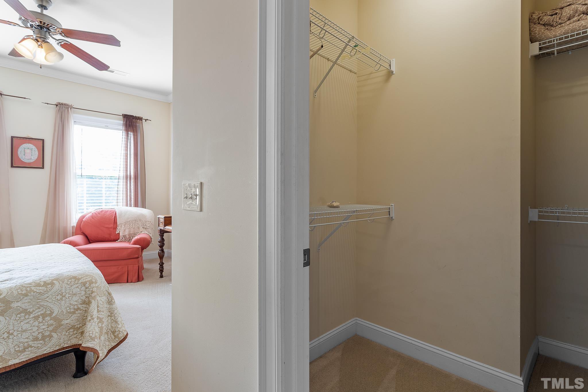 7708 Alexander Promenade Place Raleigh, NC 27617 - Photo 22 of 27 a room with two bed and a window