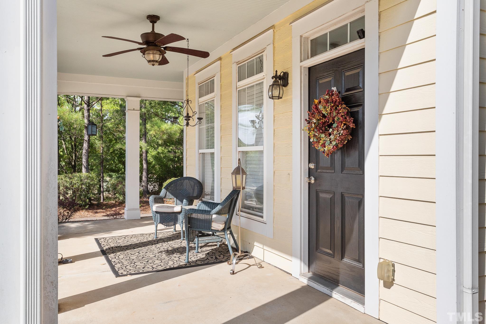 7708 Alexander Promenade Place Raleigh, NC 27617 - Photo 3 of 27 a living room with furniture and a window
