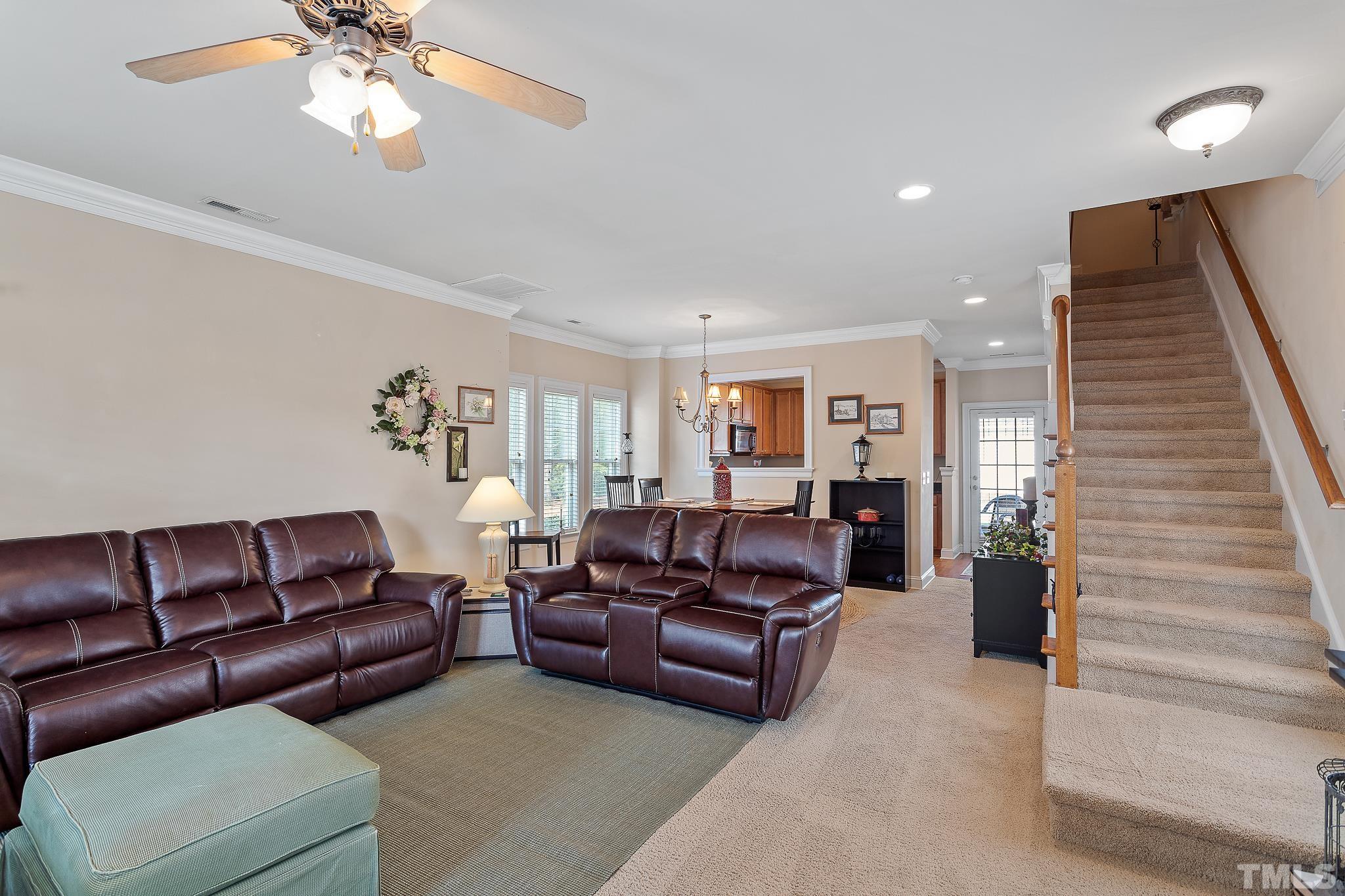 7708 Alexander Promenade Place Raleigh, NC 27617 - Photo 5 of 27 a living room with furniture