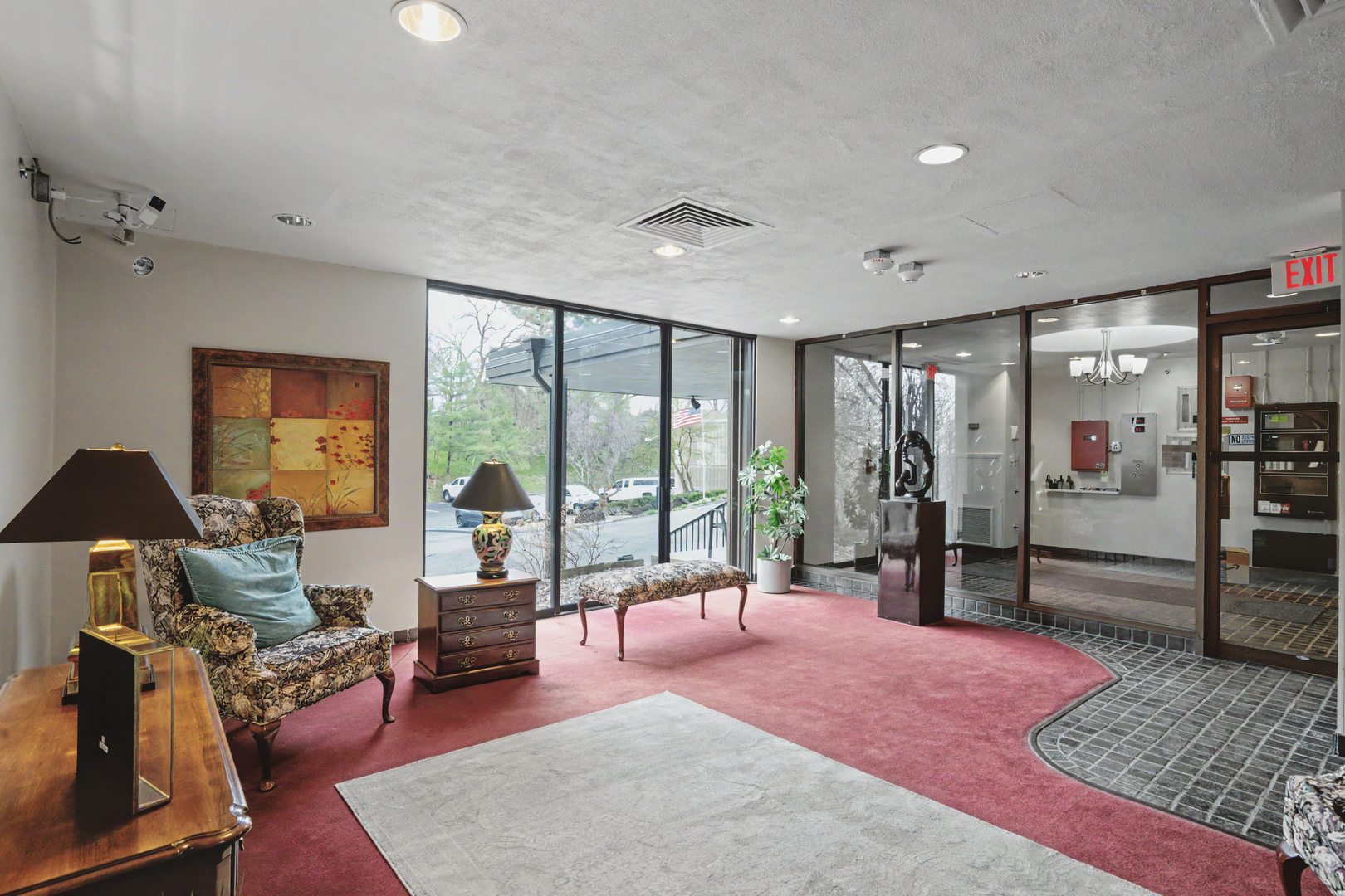 1800 7th Street, Unit 5D East Moline, IL 61244 - Photo 20 of 24 a living room with furniture a rug and a floor to ceiling window