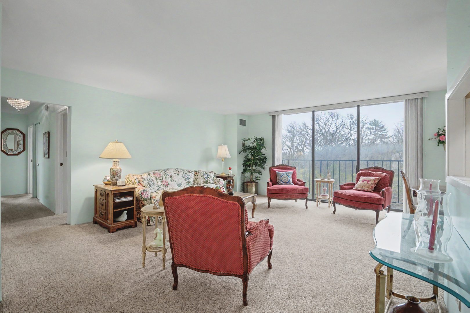 1800 7th Street, Unit 5D East Moline, IL 61244 - Photo 3 of 24 a living room with furniture and a floor to ceiling window
