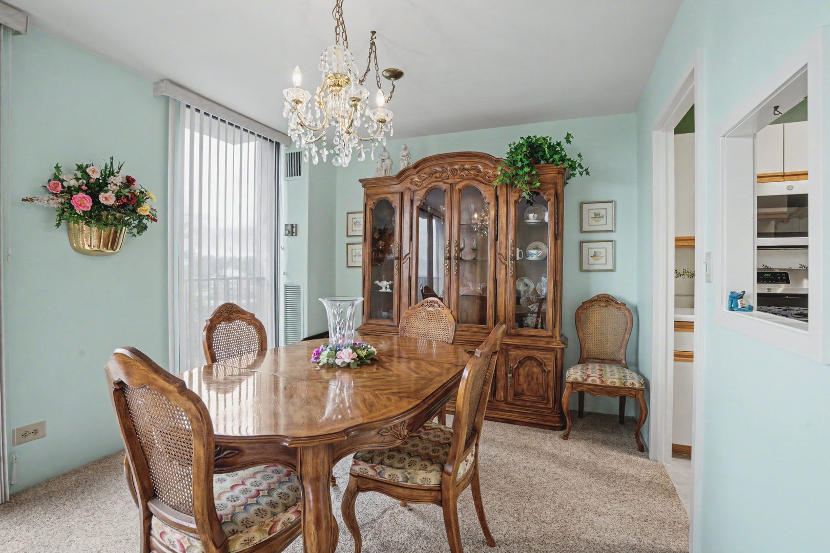 1800 7th Street, Unit 5D East Moline, IL 61244 - Photo 6 of 24 a dining room with furniture a chandelier and wooden floor