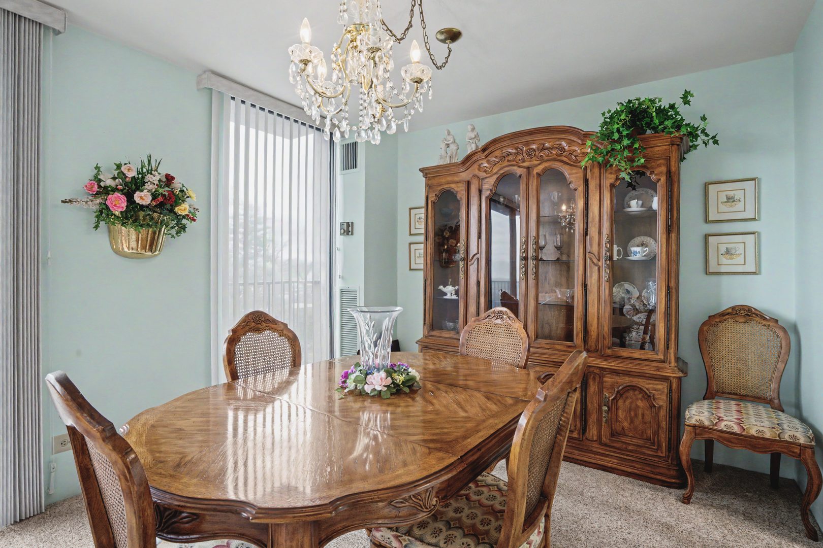 1800 7th Street, Unit 5D East Moline, IL 61244 - Photo 7 of 24 a view of a dining room with furniture wooden floor and chandelier