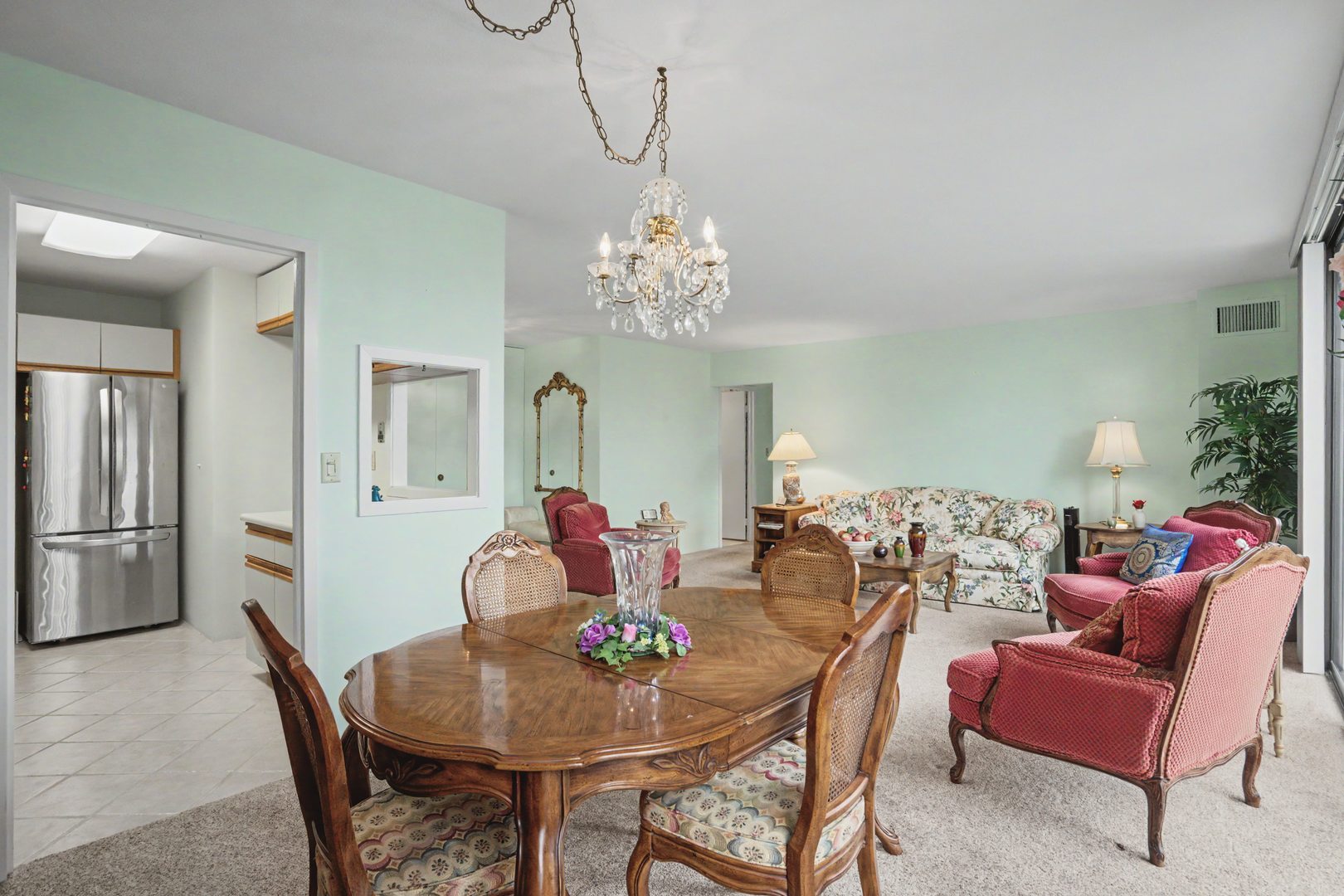 1800 7th Street, Unit 5D East Moline, IL 61244 - Photo 8 of 24 a view of a dining room with furniture and chandelier