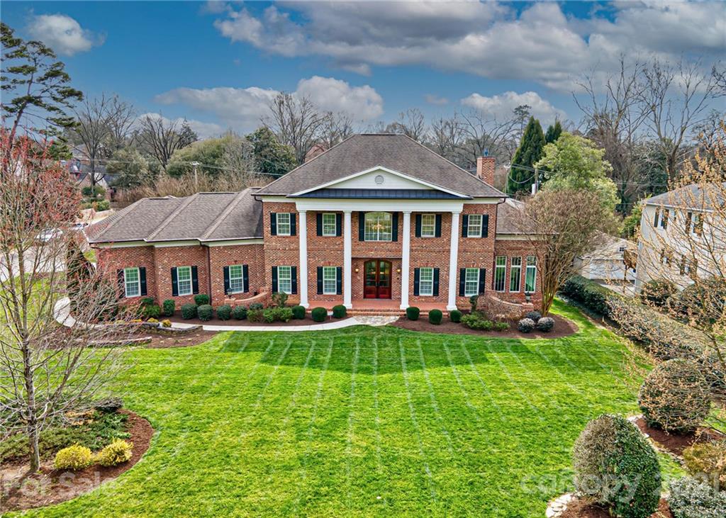 2105 South Wendover Road Charlotte, NC 28211 - Photo 1 of 46 a front view of a house with a yard table and chairs