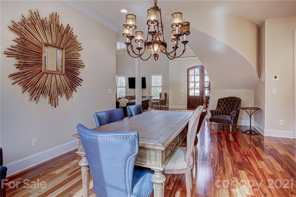2105 South Wendover Road Charlotte, NC 28211 - Photo 14 of 46 a view of a dining room with furniture and wooden floor