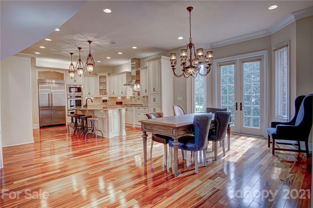 2105 South Wendover Road Charlotte, NC 28211 - Photo 15 of 46 a view of a dining room with furniture window and wooden floor