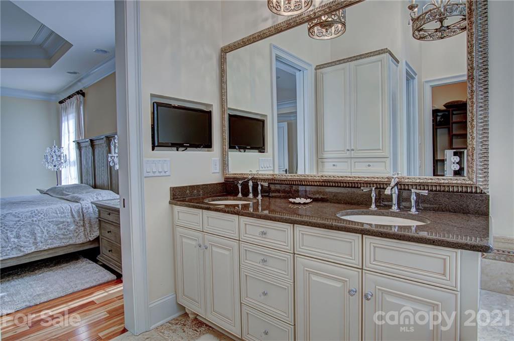 2105 South Wendover Road Charlotte, NC 28211 - Photo 23 of 46 a en suite bathroom with 2 sink and a mirror