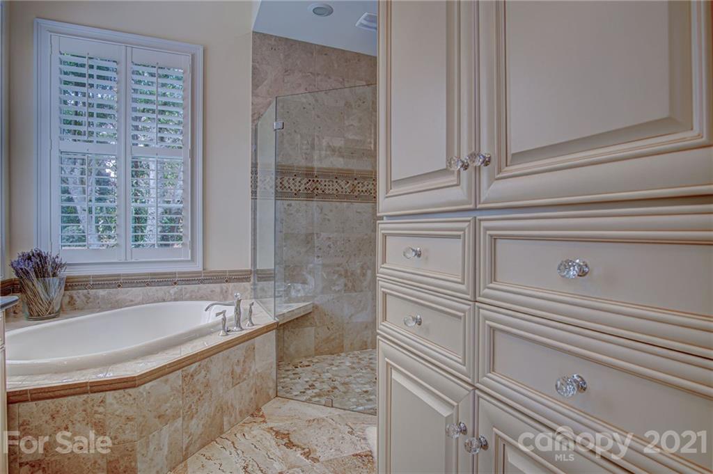 2105 South Wendover Road Charlotte, NC 28211 - Photo 24 of 46 a bathroom with a bathtub and a sink