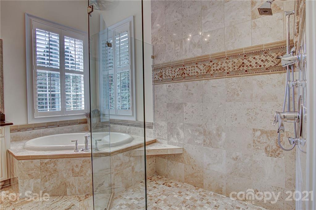 2105 South Wendover Road Charlotte, NC 28211 - Photo 25 of 46 a bathroom with a bath tub and shower